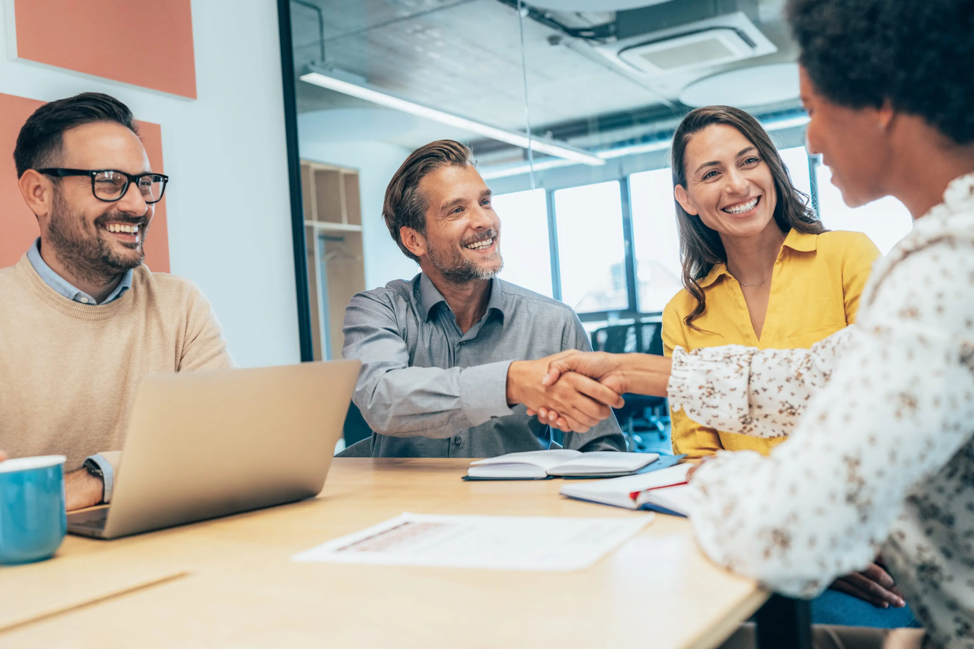 Cropped shot of two businesspeople shaking hands during a meeting at the office. Handshake for new agreement. Coworkers meet and greet together. Job interview